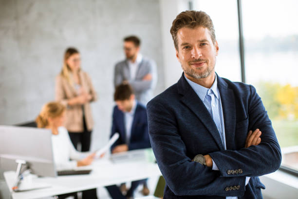 istock Handsome young business man standing confident in the office 1324904314