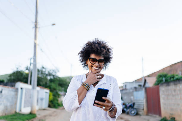 istock Using smartphone in the neighborhood 1324904452