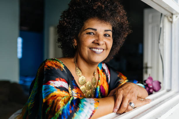 Afro woman smiling at home