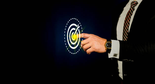istock Businessman touching the target icon on screen 1324909204