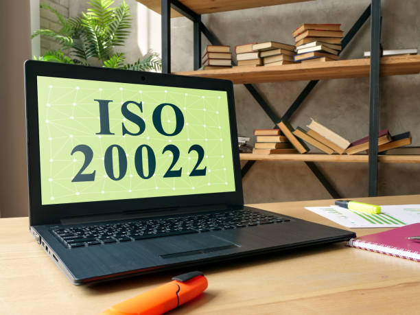 istock Laptop with information about ISO 20022 standard for payments messaging. 1324909282