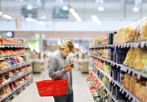 istock man choosing a dairy products at supermarket 1324911259