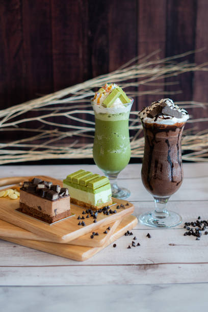 chocolate cake and smoothie on wood table background