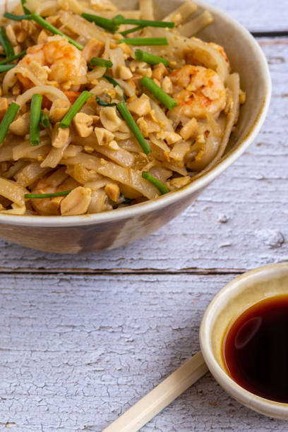 istock Pad Thai: Rice noodles with prawns and peanuts. Typical Thai food 1324915420