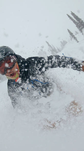 istock Skier descends snow slope through deep powder snow 1324916526