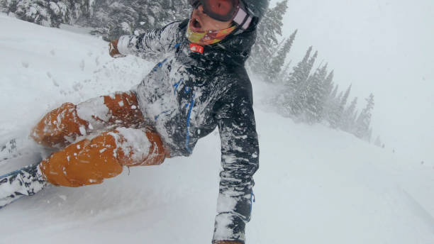 istock Skier descends snow slope through deep powder snow 1324916540