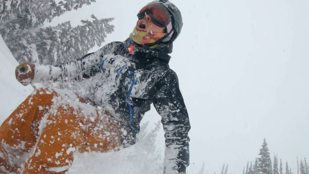 istock Skier descends snow slope through deep powder snow 1324916545