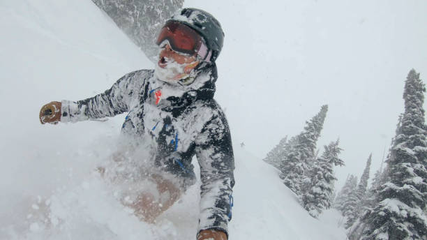 istock Skier descends snow slope through deep powder snow 1324916595