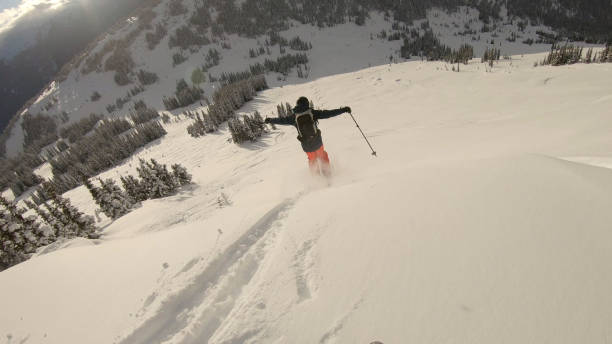 istock POV as skier descends slope through deep powder snow 1324921267