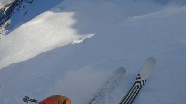 istock POV as skier descends slope through deep powder snow 1324921327