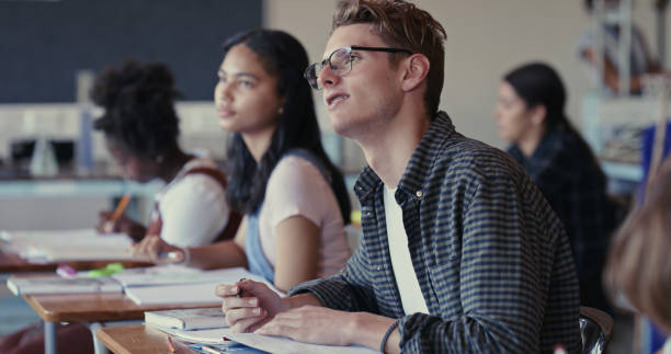 istock Shot of a student asking a question during a lesson in a classroom 1324923686