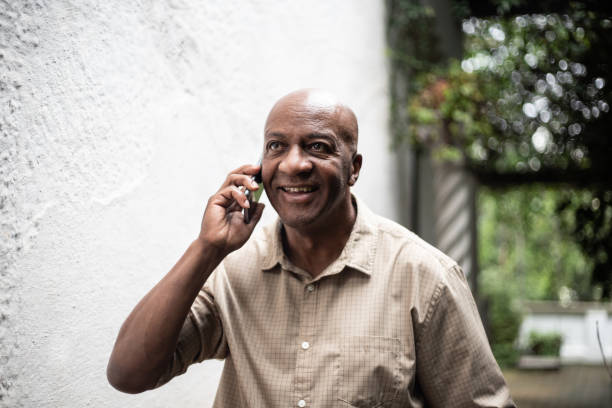 istock Senior man on a call using smartphone outdoors 1324925751