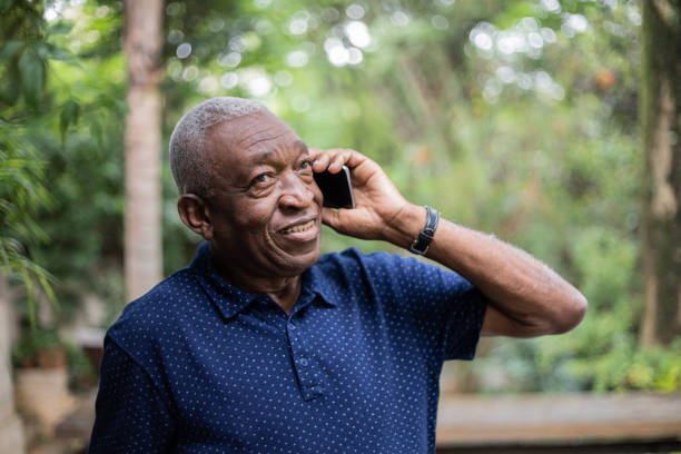 istock Senior man on a call using smartphone outdoors 1324925762