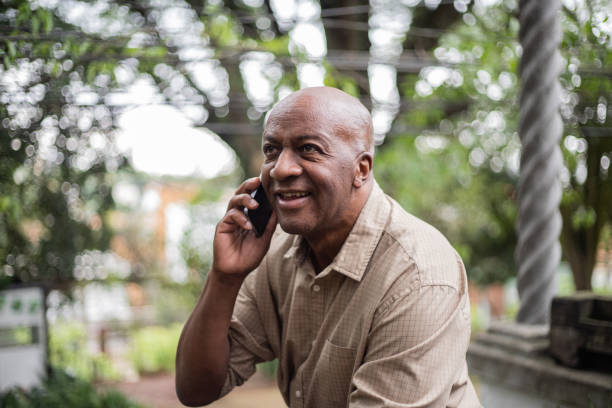 istock Senior man on a call using smartphone outdoors 1324925806