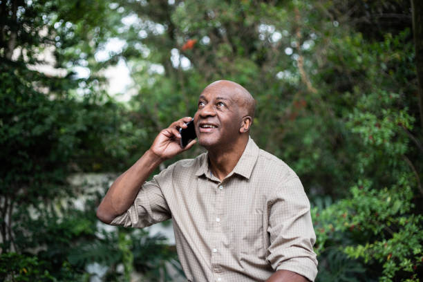 istock Senior man on a call using smartphone outdoors 1324925825