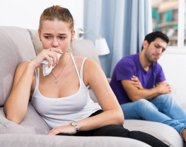 istock Woman on sofa after quarrel with husband 1324925838