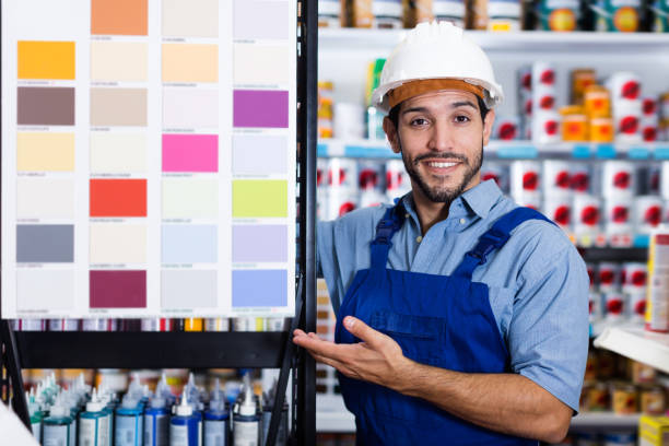 istock Adult foreman showing samples of paint 1324925917