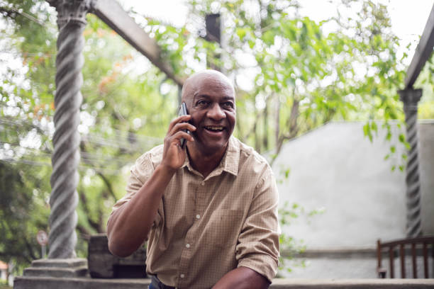 istock Senior man on a call using smartphone outdoors 1324926466