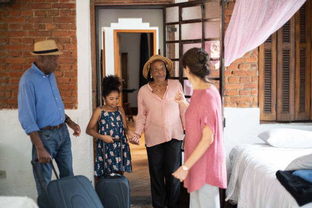 istock Host welcoming guests at house rental 1324926573