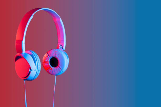 Headphone on computer at workplace office table. Audio digital equipment.