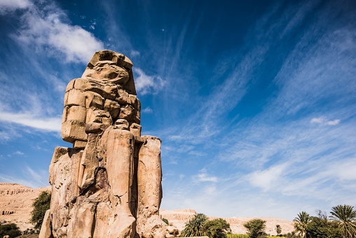 The Colossi of Memnon are two giant stone statues of Pharaoh Amenhotep III. Luxor, West Bank, Egypt