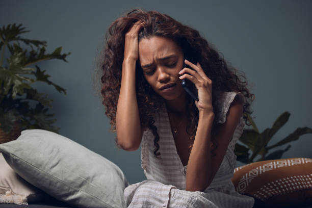 istock Shot of a woman looking sad while talking on her cellphone 1324929525