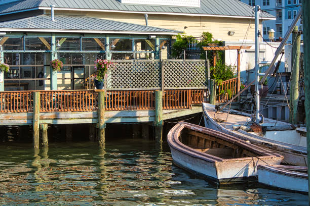 istock Old boat near a building 1324932897