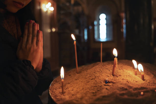 istock Praying at the church 1324935167