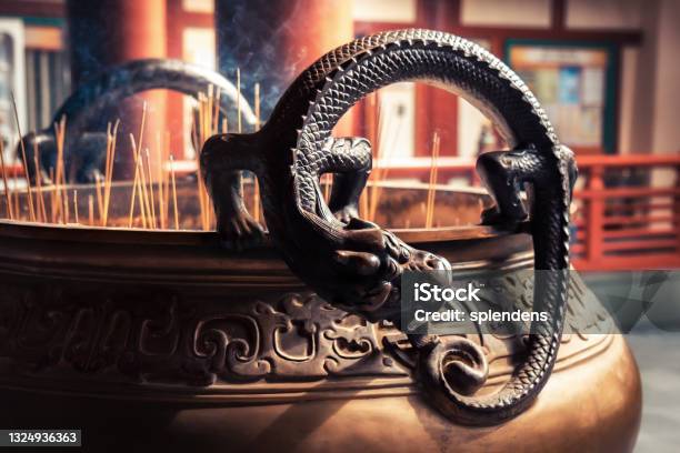 Dragon Deity On Worship Bowl With Candlestick In Asian Buddha Tooth Relic Temple In Singapore Stock Photo - Download Image Now