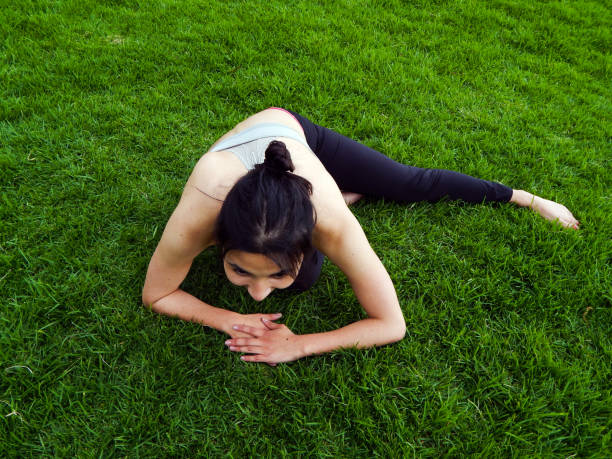 istock Woman exercising in the park 1324936684