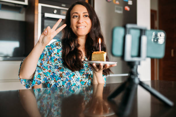 istock Vlogger celebrating her birthday with her followers while live stream 1324942139