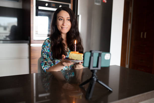 istock Vlogger celebrating her birthday with her followers while live stream 1324943055