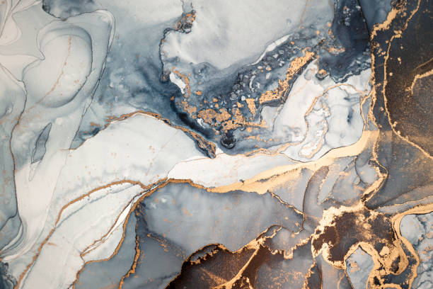 Luxury abstract fluid art painting in alcohol ink technique, mixture of gray, black and gold paints. Imitation of marble stone cut, glowing golden veins. High resolution. Elegant minimalistic design, modern art. gold layer stock pictures, royalty-free photos & images