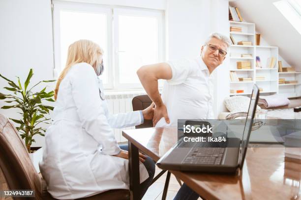 Patient Complains To The Doctor Of Kidney Pain Stock Photo - Download Image Now - Kidney - Organ, Nephropathy, Pain
