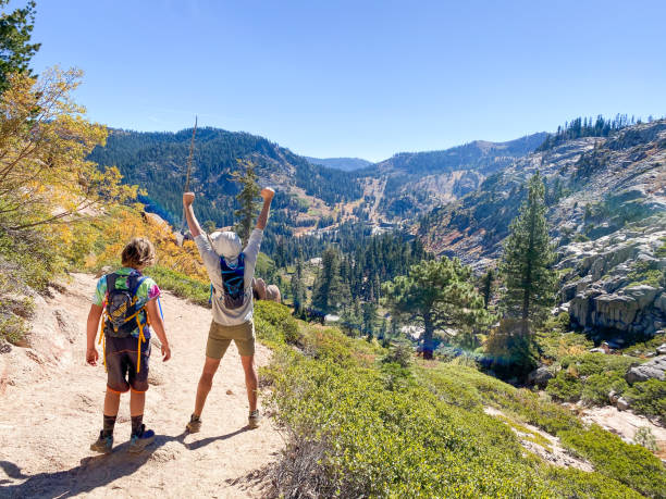 istock Father and son celebrating hiking together. 1324943312
