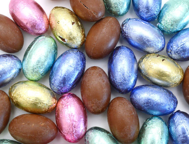 istock Chocolate easter eggs in colorful foil on white background 1324946140