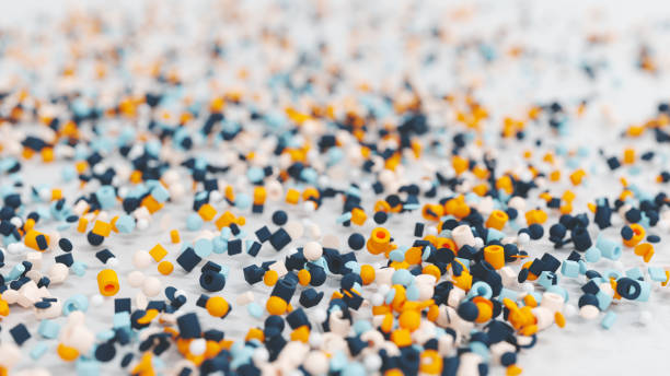 Little plastic beads Many small plastic beads falling on the floor microplastic stock pictures, royalty-free photos & images