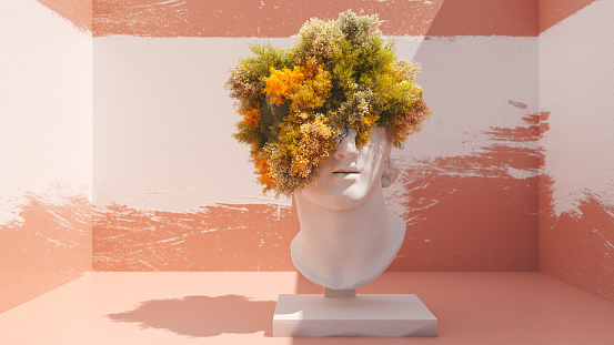 Head statue with lush plants for hair