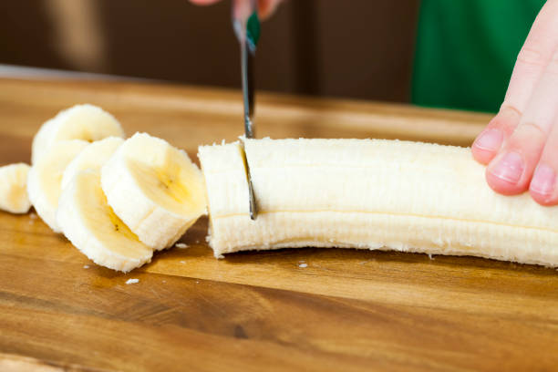 istock making smoothies with yellow banana 1324950380