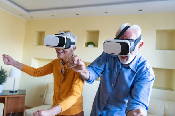 istock Elderly Man and his Wife are Browsing a Virtual World with Virtual Reality Goggles. 1324954326