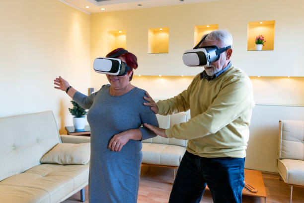 istock Elderly Man and his Wife are Browsing a Virtual World with Virtual Reality Goggles. 1324954932
