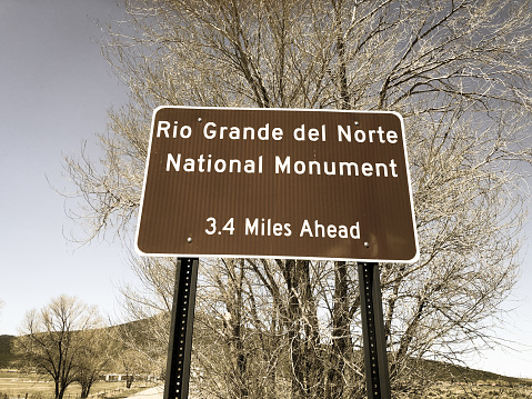 Outdoor public basketball hoop in nature background.