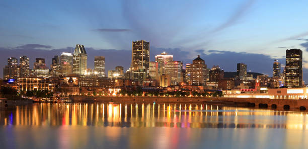 istock Montreal skyline at dusk with lights reflections on St Lawrence River in Quebec 1324960126