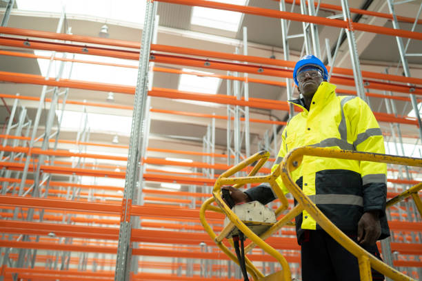 istock Warehouse worker during his job with a moving stock 1324961980