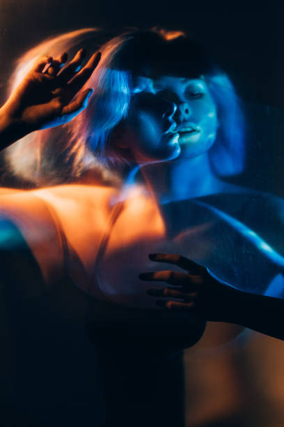 istock psychedelic silhouette mysterious woman blue light 1324962608