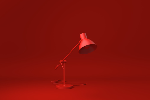 Red Desk lamp in Red background. minimal concept idea creative. monochrome. 3D render.