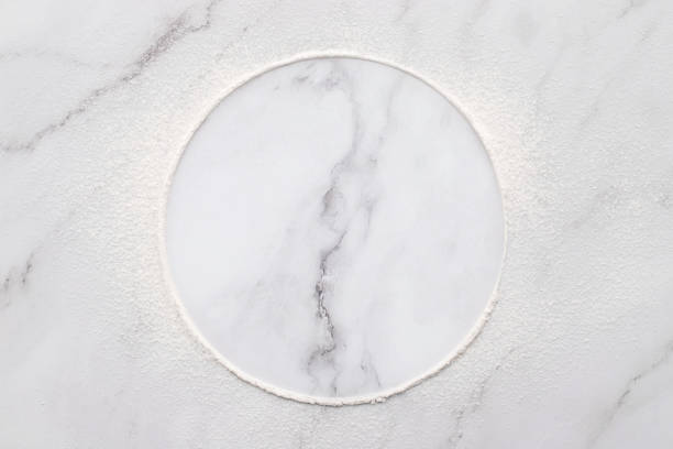 istock Scattered wheat flour on white marble background. Sprinkled wheat flour circle on white background. 1324963167