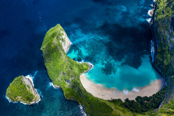 Kelingking beach in Nusa Penida in Bali Indonesia Aerial drone landscape of the famous beach of Kelingking and located on the island of Nusa Penida in Bali Indonesia. kelingking beach stock pictures, royalty-free photos & images