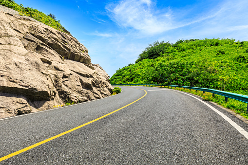 Mountain road natural landscape on a sunny day.