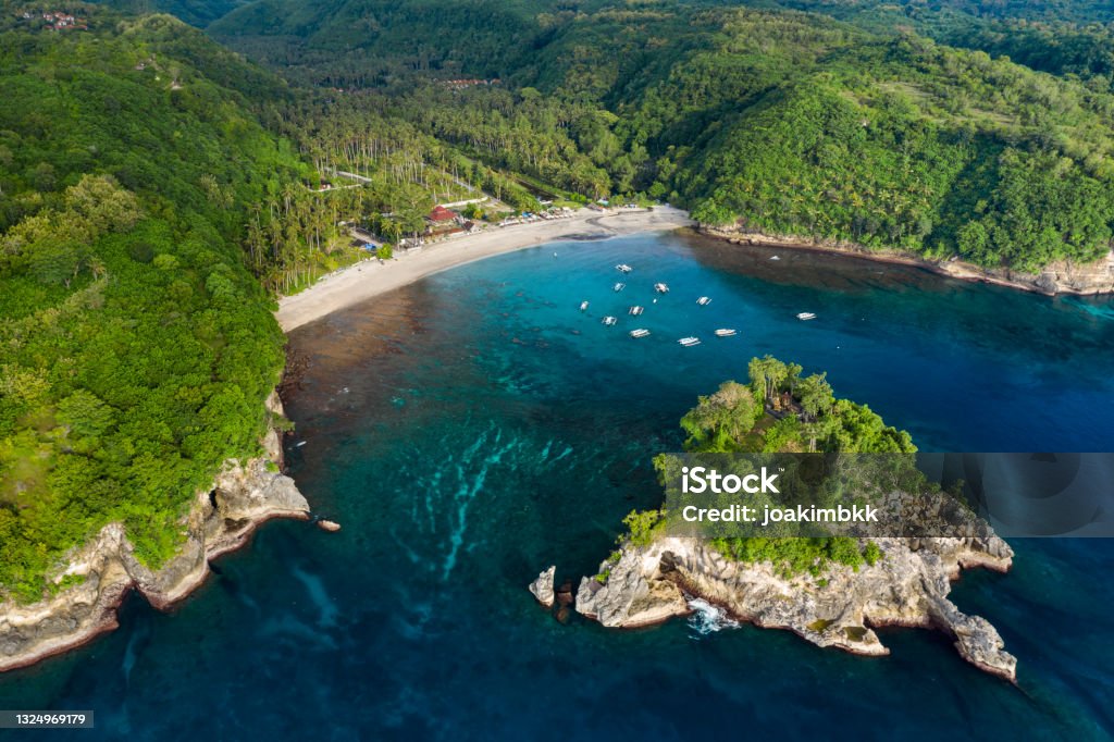 Crystal Bay in Nusa Penida in Bali Indonesia Aerial drone landscape of the famous Crystal Bay beach in Nusa Penida in Bali Indonesia. Island Stock Photo